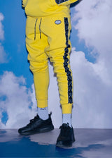 VINYL Φόρμα με τρέσα και οβάλ λογότυπο Κίτρινο - Taped Side Pants